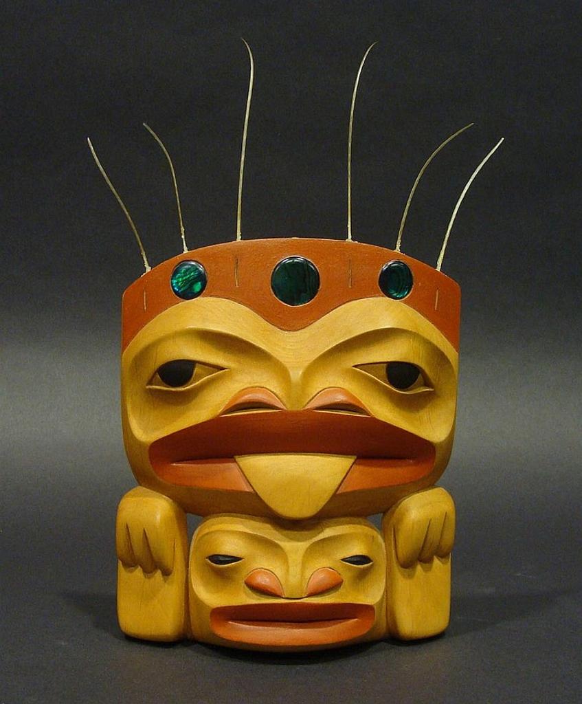 Dempsey Bob (1948) - a carved and polychromed alder Frog design frontlet